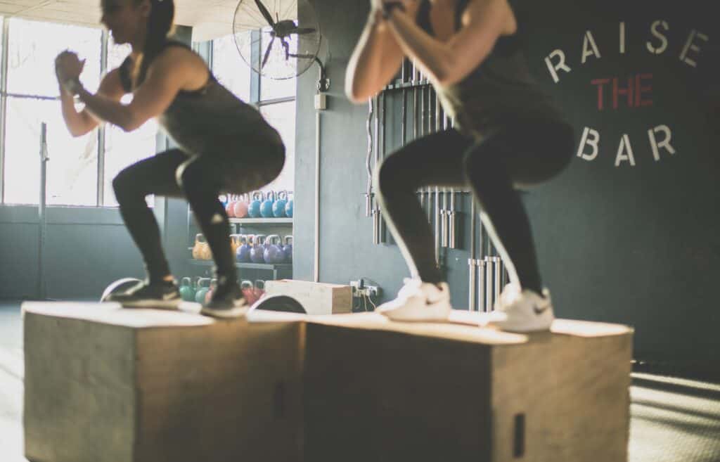 People exercising on a box