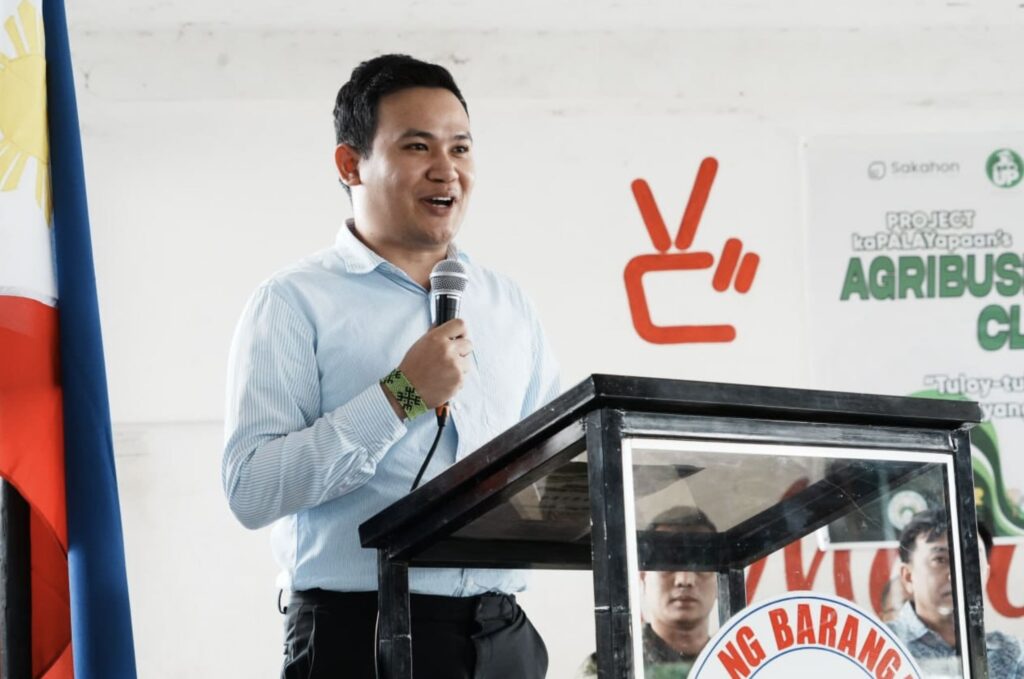 Elvin Jerome Austria Laceda, speaks to 108 farmers successfully finished RiceUp's Agribusiness Training Program, breaking barriers to achieve lasting peace in Hacienda Luisita.